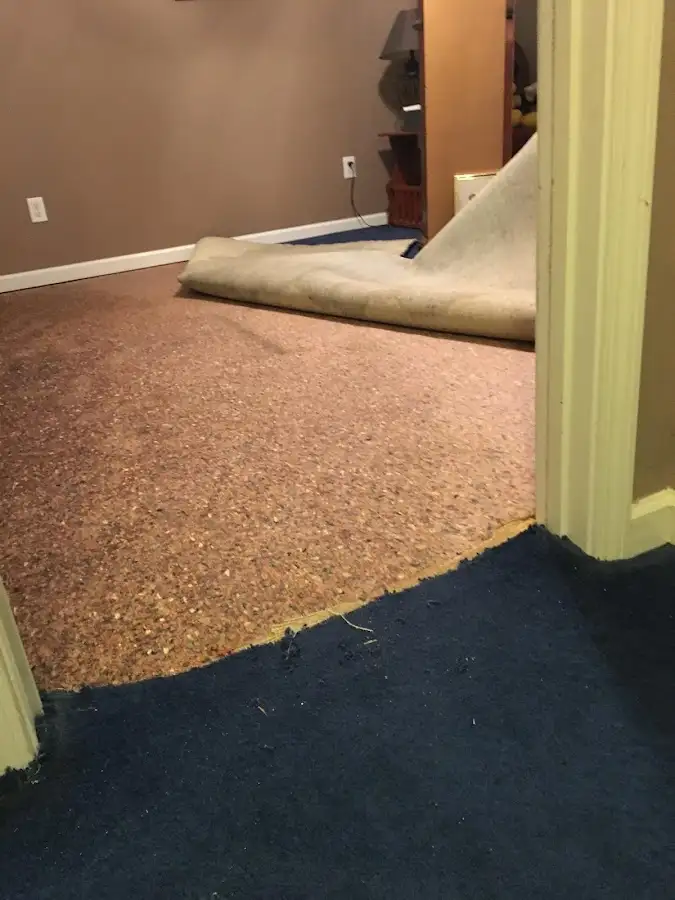 Carpet pad removal revealing water damage during Drying & Dehumidification in Airway Heights